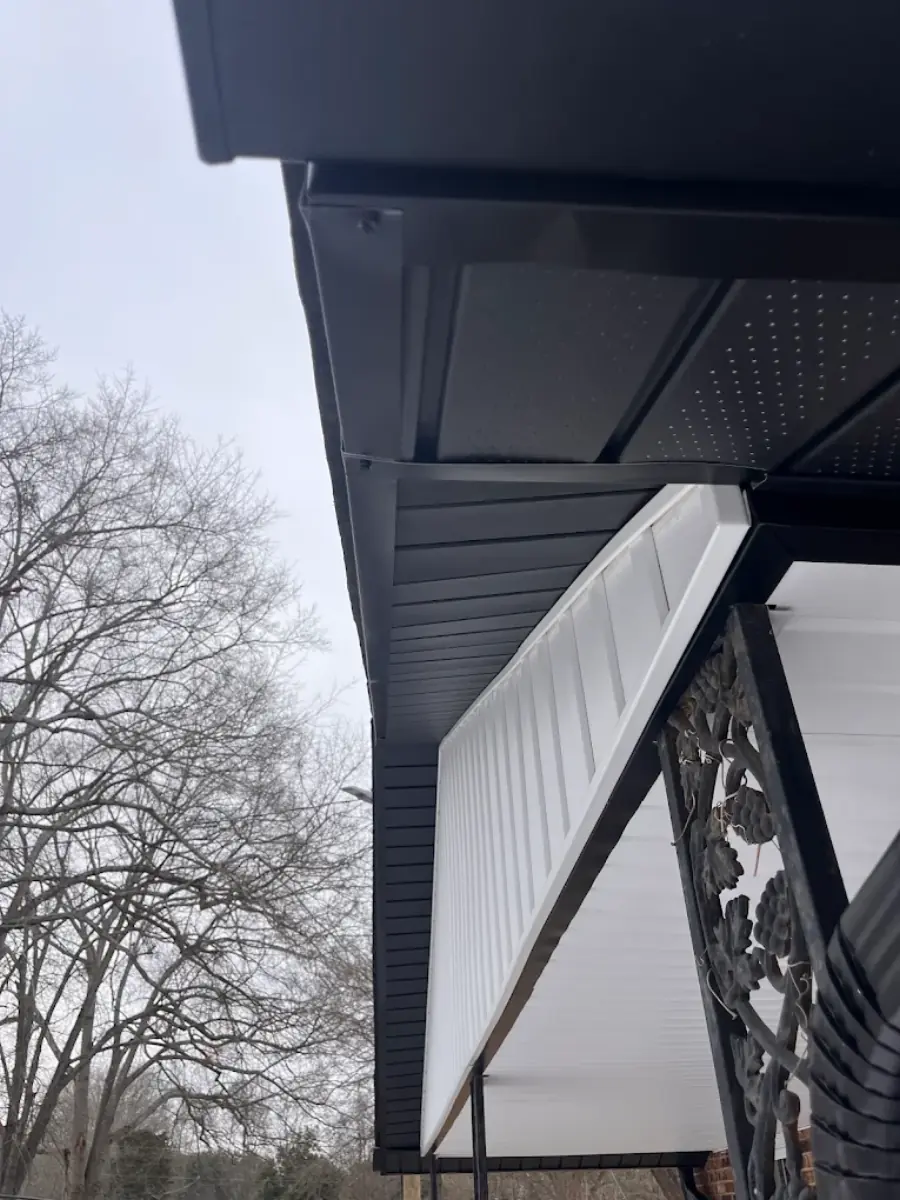 Close-up of new black soffit and trim installation