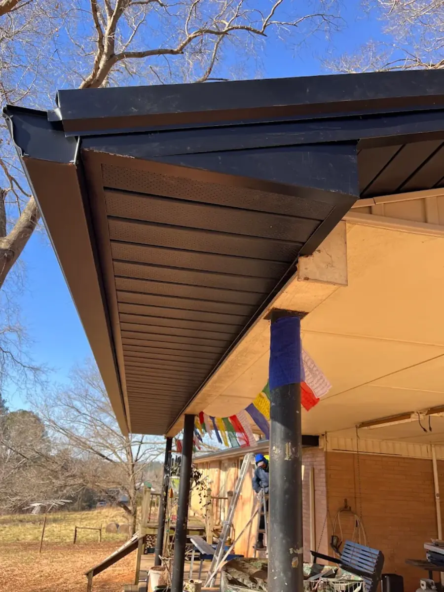 New soffit, fascia, and gutter installation under a roofline